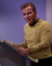 James T. Kirk with book at lectern