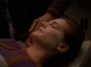 Sisko caressess Jadzia's face
