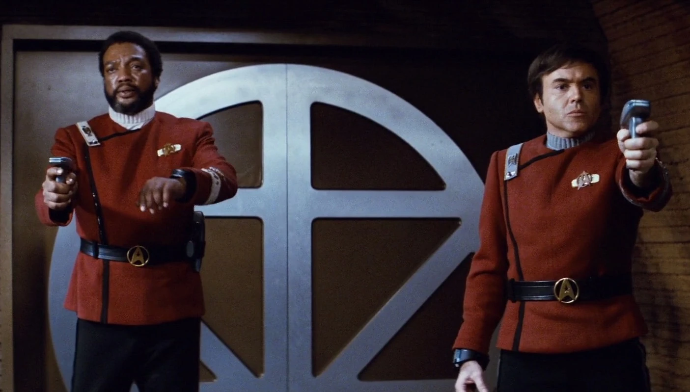 Terrell and Chekov aim phasers