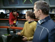 Uhura informs Kirk and Ferris of habitable planet