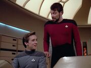 Wesley Crusher and William T. Riker react to Data's odd behavior