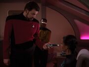 William Riker shows Aquiel Uhnari a hidden phaser