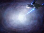 The Enterprise-D firing at an anti-time eruption anomaly with a tachyon pulse