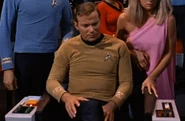 Constitution command chair console, 2266.jpg (351 KB) James Kirk sits in the updated chair with viewer removed in 2266