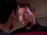 Troi scratches Riker