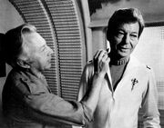 Werner Keppler applying makeup to Kelley