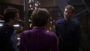 Malcolm Reed and T'Pol survey damage in engineering
