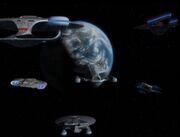 USS Voyager escorted home