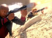 Sisko firing phaser rifle