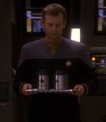 Starfleet officer serving coffee