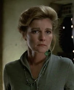 Janeway wearing Caylem's necklace