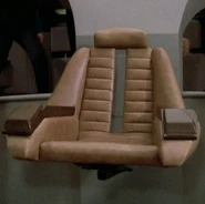 TNG First Season Command Chair.jpg (132 KB) The command chair in 2364 with command consoles closed