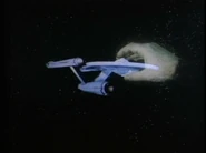 Original grey "hand" gripping the Enterprise…