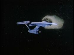 Apollo's hand grips the Enterprise.jpg