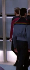 In a corridor Played by an unknown actor (TNG: "Coming of Age")