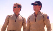 Captain Archer and Trip Tucker in desert attire, with sunglasses and uniform caps