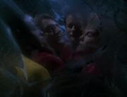 Janeway, Tuvok, Q, and Quinn inside Quinn's prison