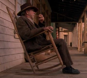 An old man in a rocking chair