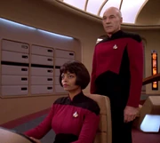 Gates with Captain Picard on the bridge.