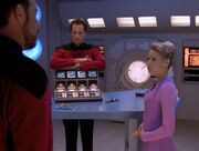 Amanda Rogers talks to William Riker and Q