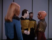 Beverly Crusher, Data, and Geordi La Forge speak with Reyga