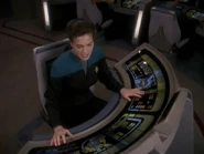 Jadzia Dax operates the helm console on the USS Defiant