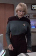 Nurse in sickbay, early 2369