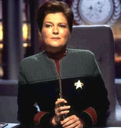 Vice Admiral Kathryn Janeway wearing her flag officer's uniform in 2378