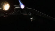 Cameron Mitchell in an F-302 fighter-interceptor flying toward the satellite