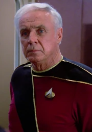 Gregory Quinn wearing one star admiral braid