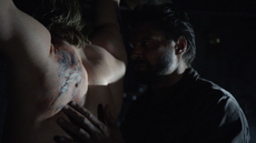 Slade brands Oliver's back with the same tattoo that Shado had