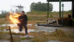 Barry running with a trail of yellow lightning