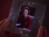 A photo of Kira that used to belong to Odo, that Kira gave to Typhuss as a gift