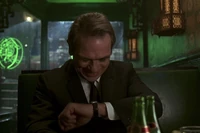 Agent K checks the time with his watch