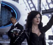 J shoots serleena.jpeg (35 KB) Agent J standing behind Serleena with the updated Arquillian Arm Cannon (Tri-Barrel Pulsar Blaster).