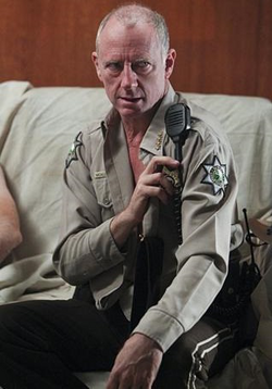 S6 EP7 Sheriff McAllister reveals his tattoo