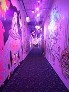 The side hall contains some doodles and comments made by Legit Concerns.[23] Several rooms exit here. It also leads to the restrooms.