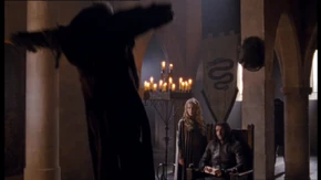 Morgause hurls Jarl into the wall.