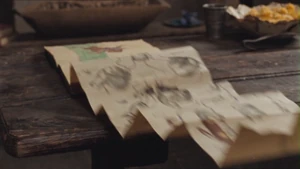 Merlin magically opens the etiquette book.