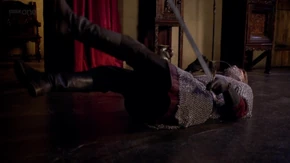 Merlin protects himself from Arthur's assault.