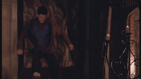 Merlin is hit by Morgana's magic.