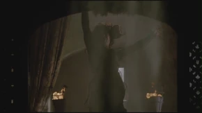 Morgana is hit by Merlin's magic.