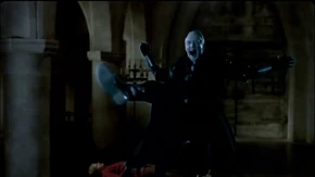 Merlin uses a stunning spell on Uther's ghost.