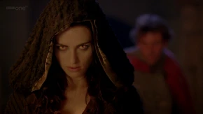 Morgana using a stunning spell to disable a guard.