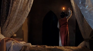 Gwen puts out the candles in Morgana's Chambers.