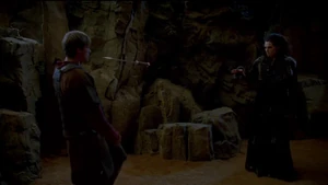 Morgana makes her dagger fly and stab Arthur.