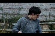 Merlin in battle, using magic for assistance