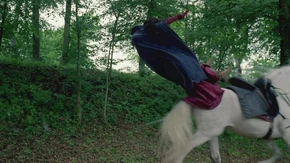 Gwen is knocked off her horse.