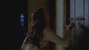 Mithian is caught by Morgana before she can reach the door.