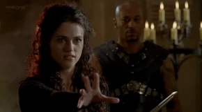 Morgana attempts to stun Arthur.
